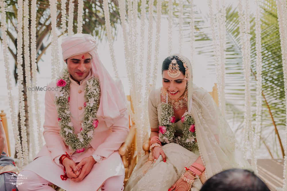 Photo of Candid shot of a couple during their wedding rituals.