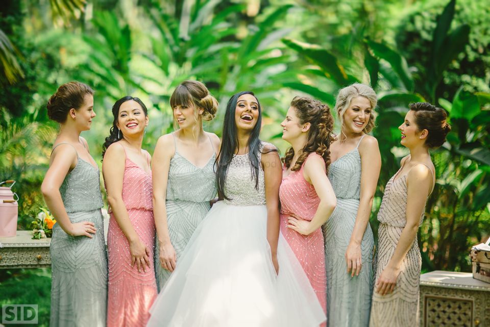 Photo of Bride with Bridesmaids in Pastel Colours