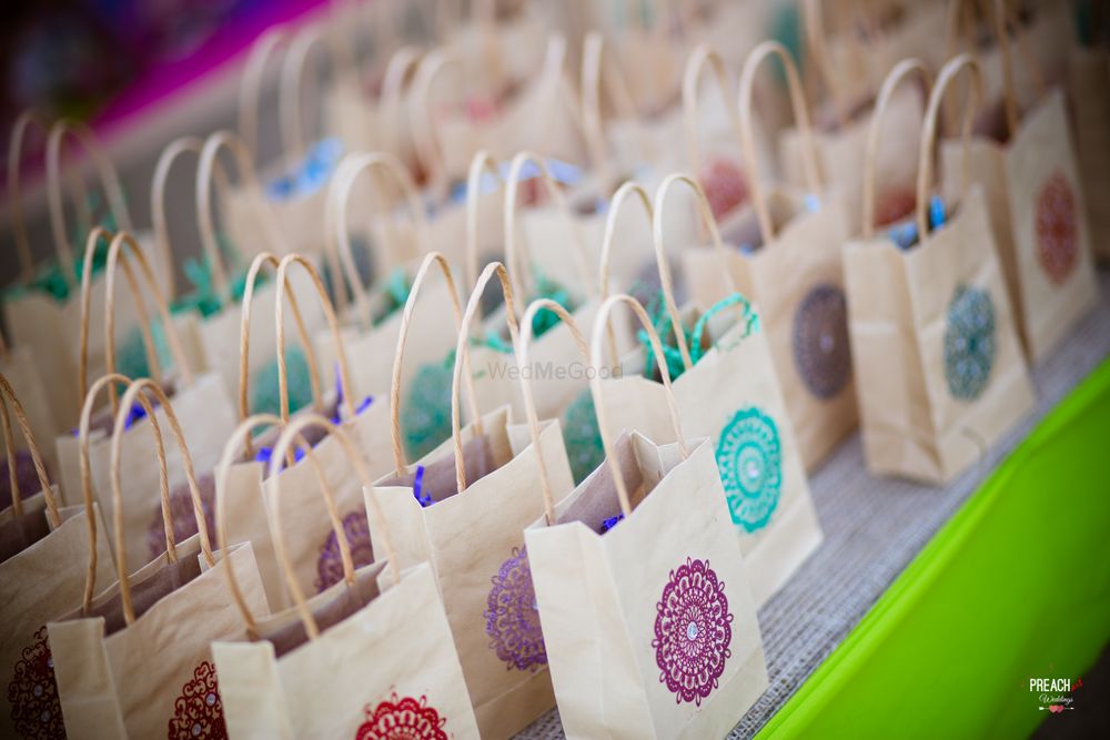 Photo of Colourful Gift Bags with Wedding Favours for Guests
