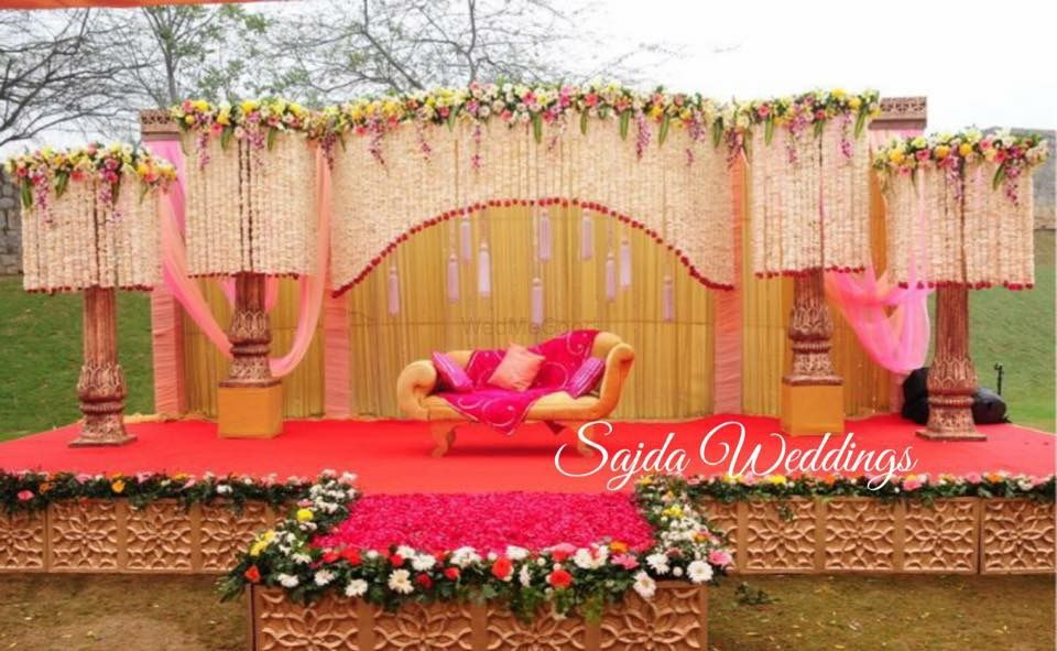 Photo of stage backdrop in pink and peach and gold