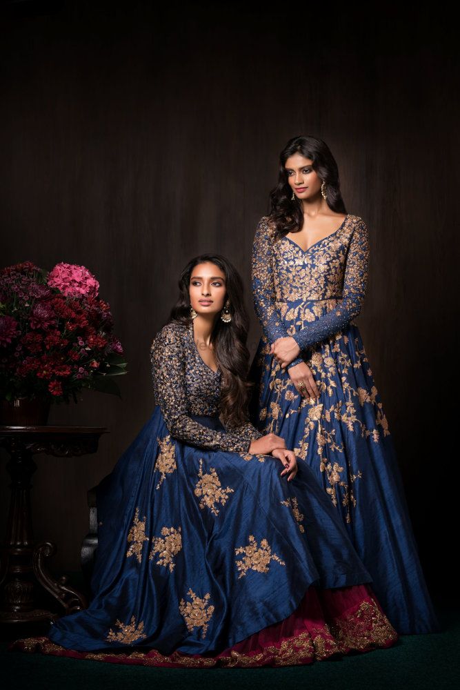 Photo of Blue and gold reception outfits by Shyamal Bhumika
