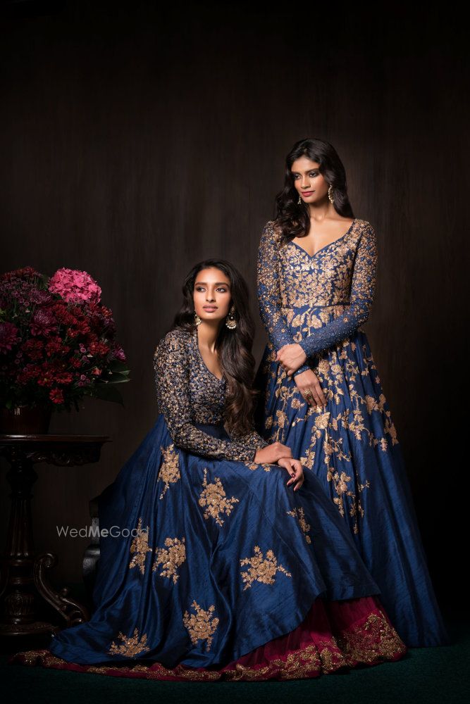 Photo of Blue and gold reception outfits by Shyamal Bhumika