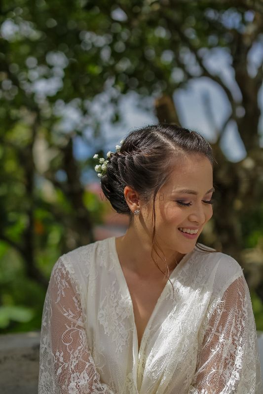 Photo of Christian bridal hairstyle with baby's breath in bun