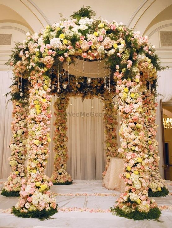 Photo of All Over Floral Mandap with Roses and Greens