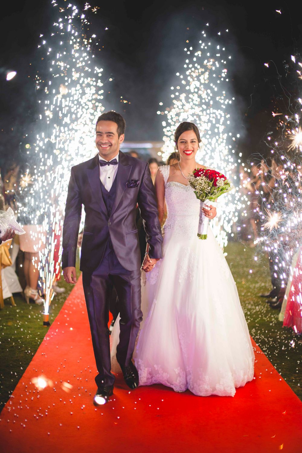 Photo of Christian Bride and Groom Entering to Fireworks