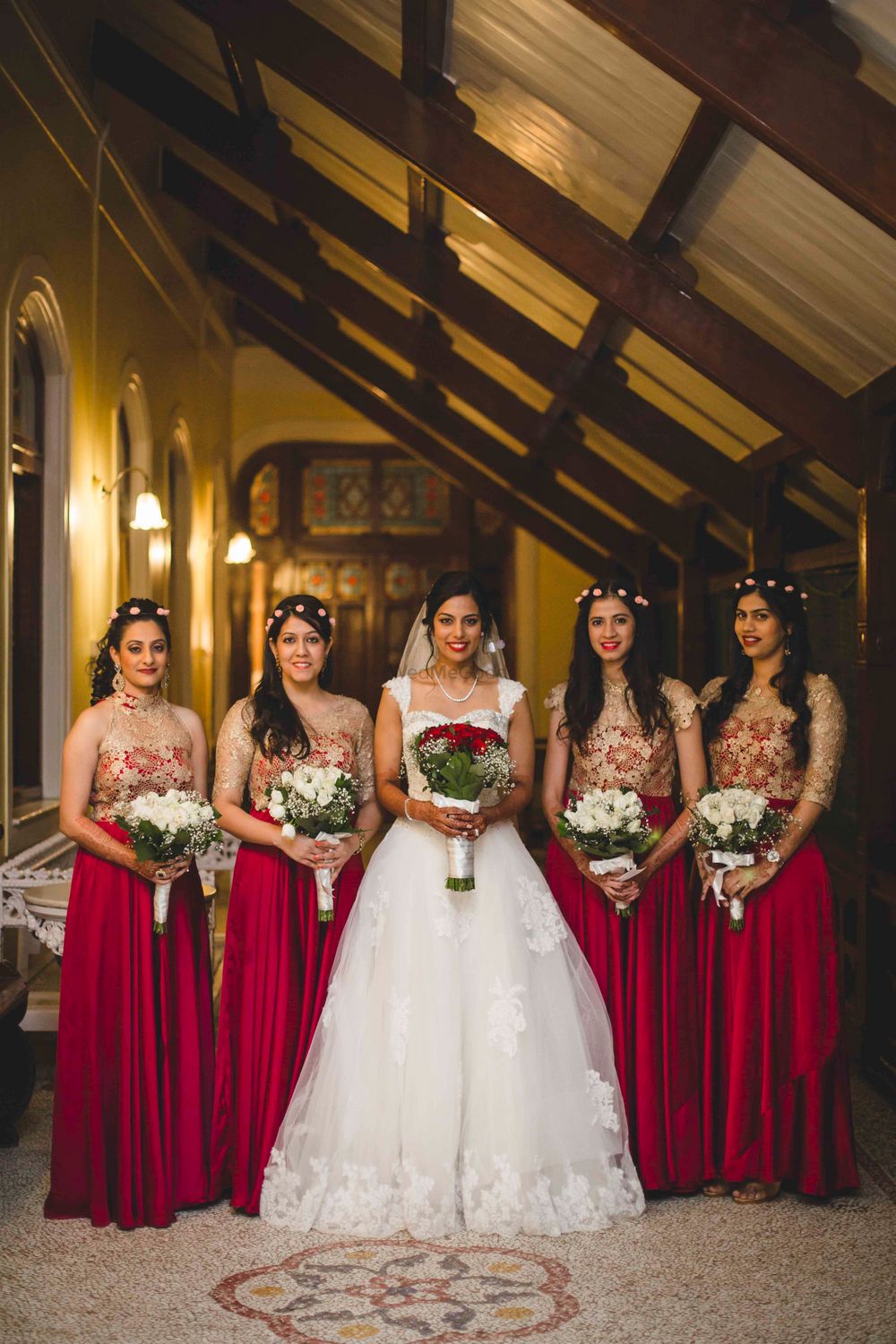 Photo of Bride with Matching Bridesmaids in Magenta Dresses