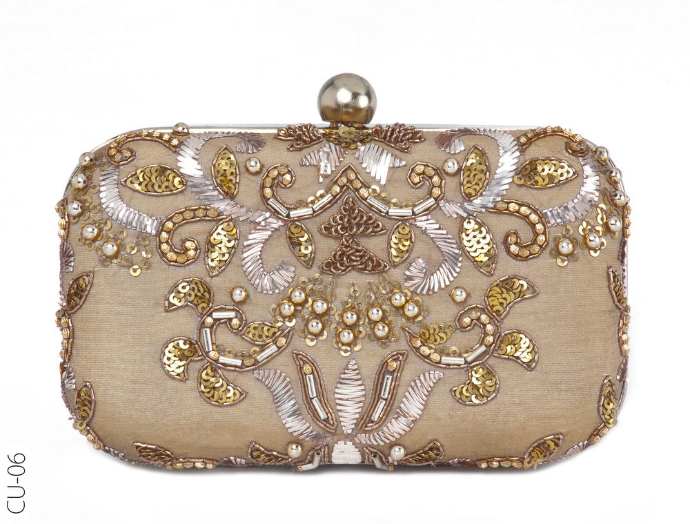 Photo of gold and beige bridal clutch with handle