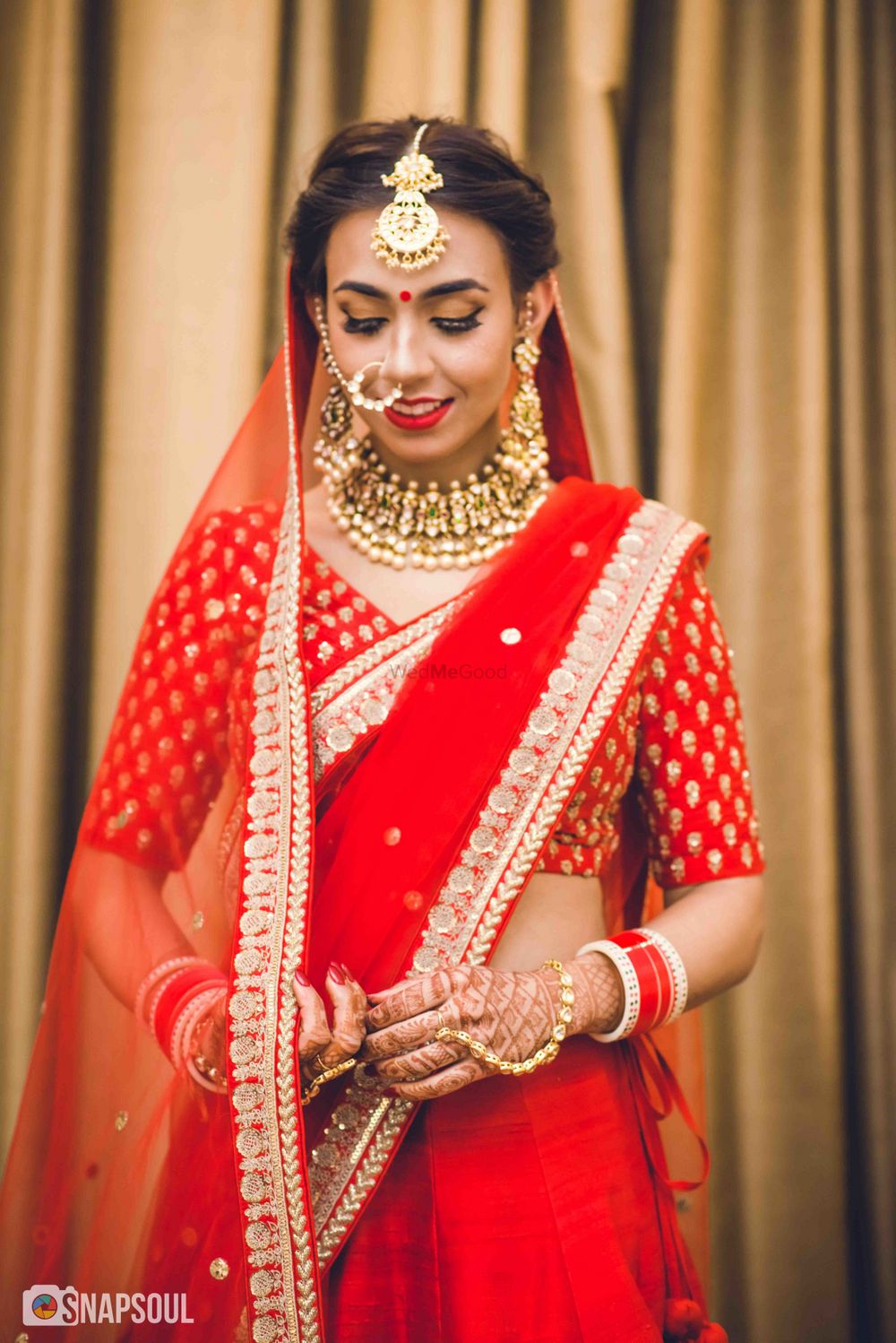 Photo of Minimal bridal lehenga with bride in red
