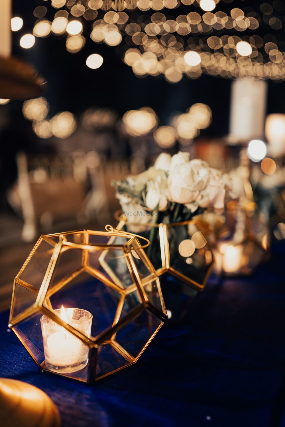 Photo of Terrariums with candles used as table centrepieces.