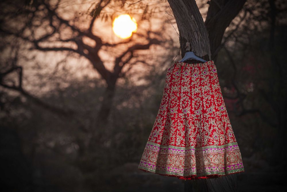 Photo of Red Embroidered Bridal Lehenga on Hanger