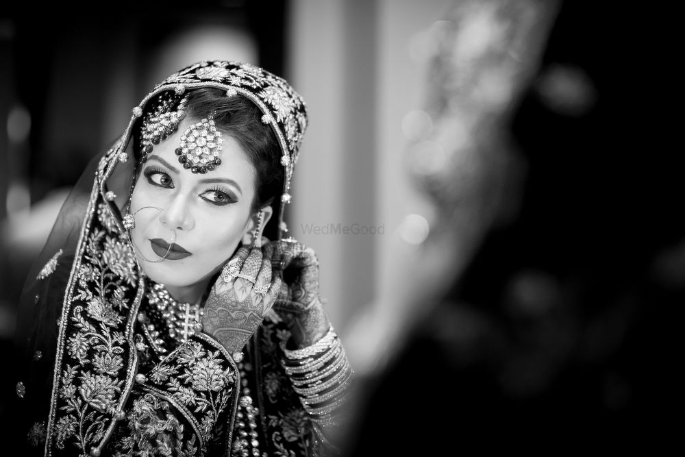 Photo of Black and White Portrait of Bride Getting Ready