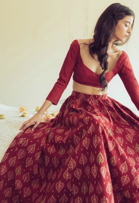 Photo of red batik printed cotton lehenga with full sleeves and scoop deep necklines