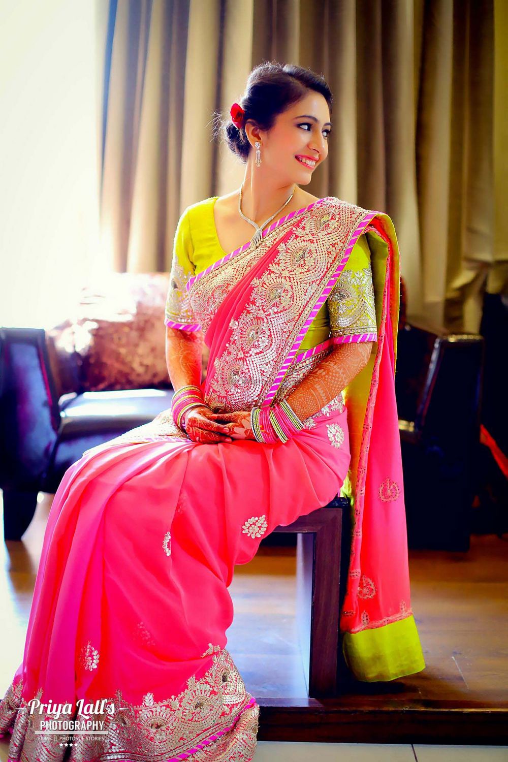 Photo of Bright Pink Saree with Lime Green Blouse and Border
