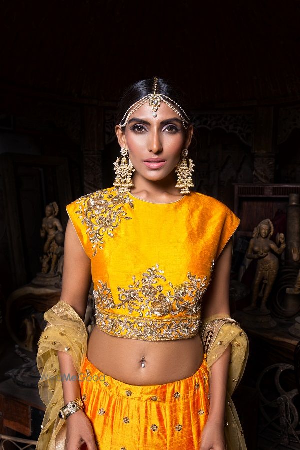 Photo of Orange Lehenga with Temple Earrings and Mathapatti