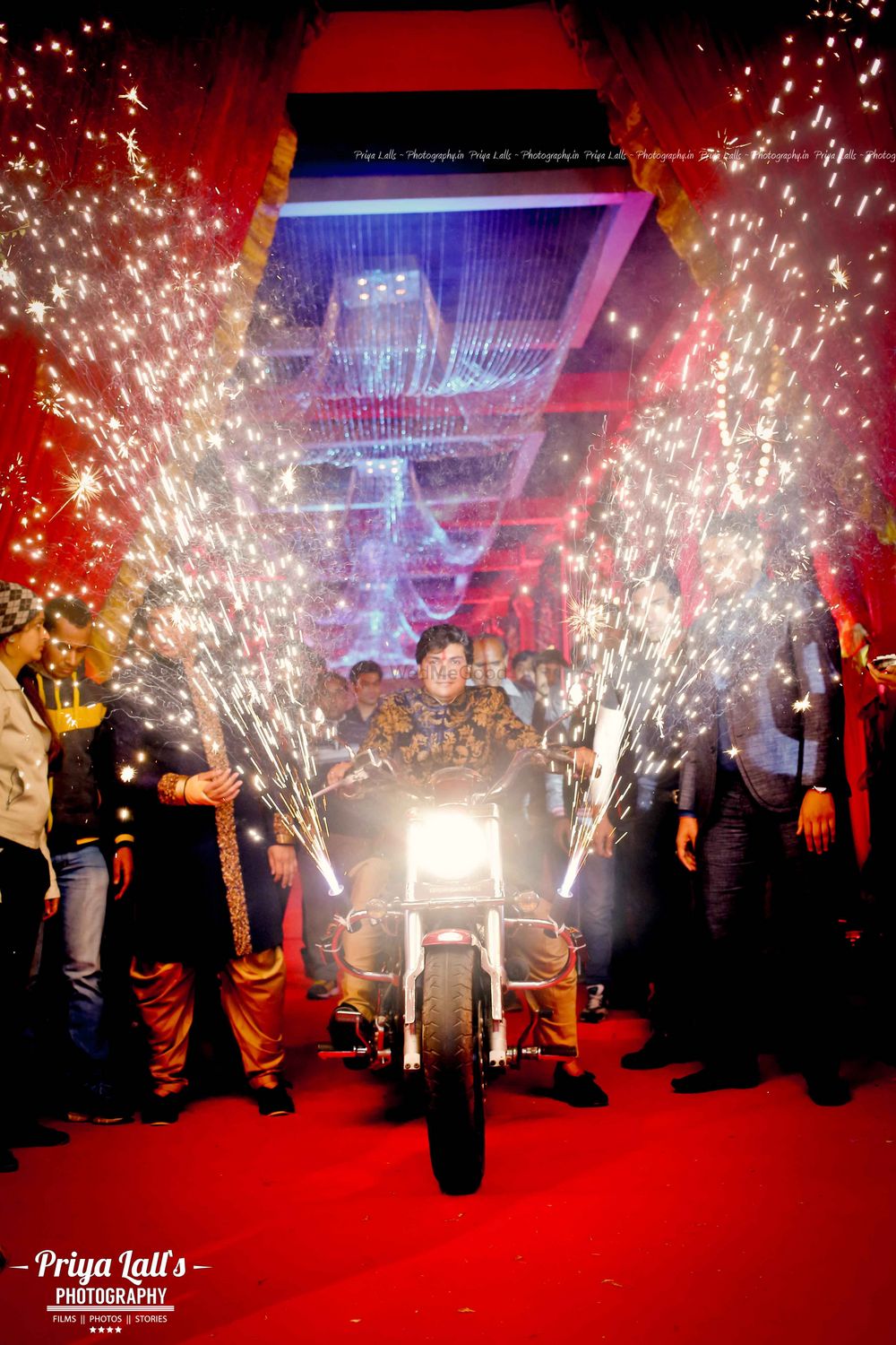 Photo of Groom Entering on Bike with Cold Pyros