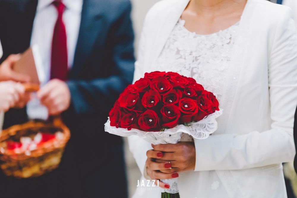 Photo of Bridal Bouquet with Red Roses and Pearls