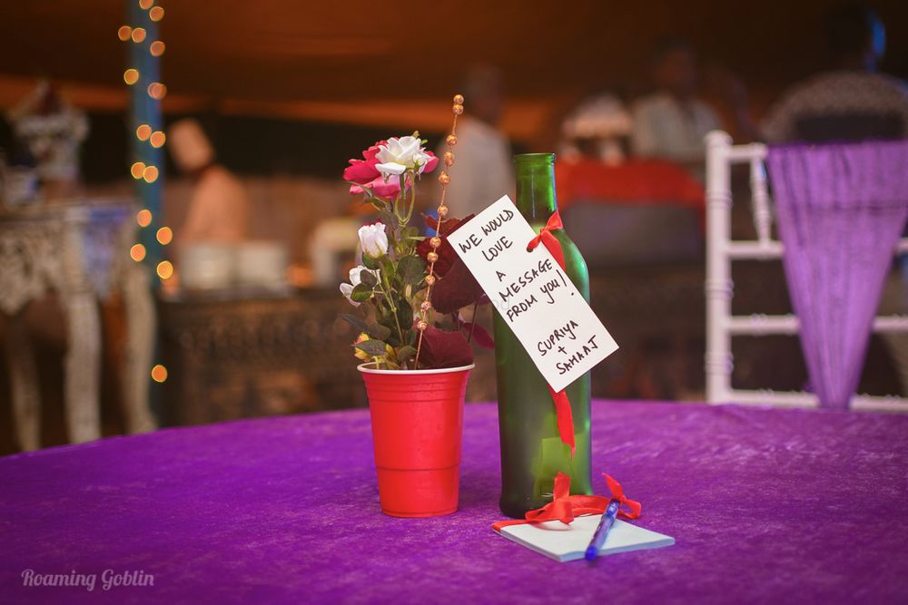 Photo of Bottle with note as table centerpiece
