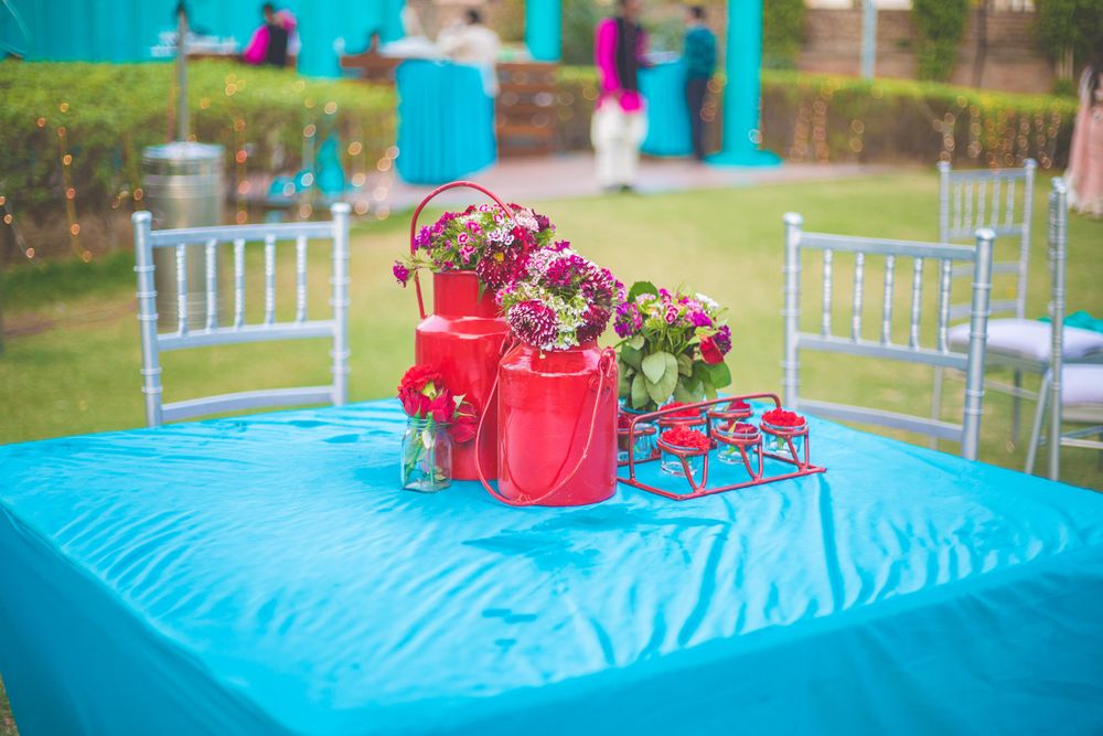 Photo of Blue and pink quirky table setting with kettle