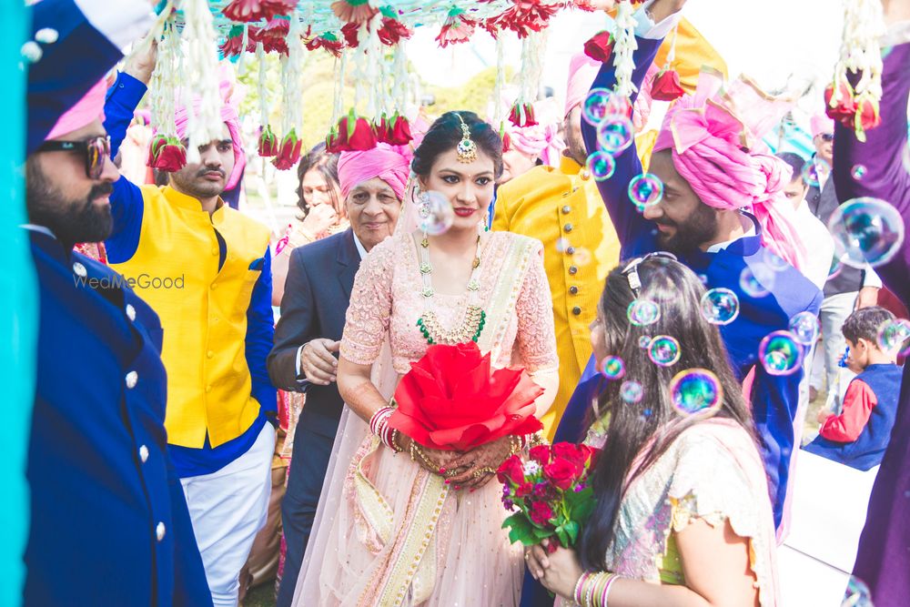 Photo of Bridal entry with guests blowing bubbles