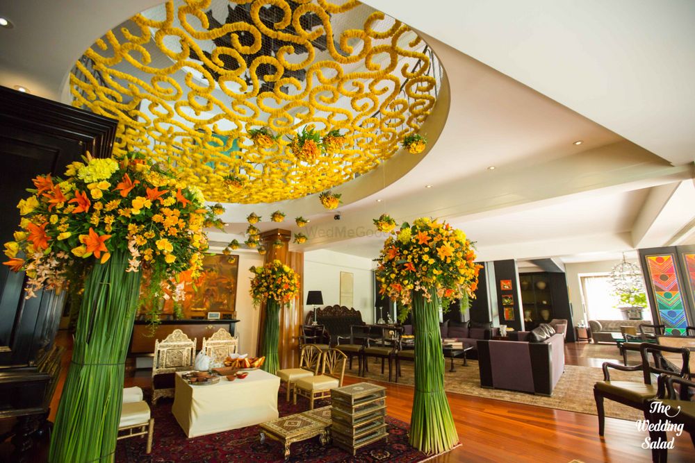 Photo of Giant floral vases and a genda flower lattice work ceiling