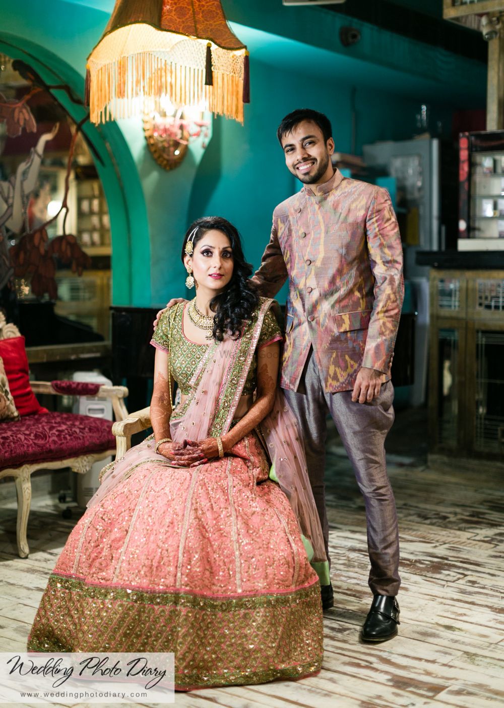 Photo of Baby pink lehenga with green and gold blouse and border