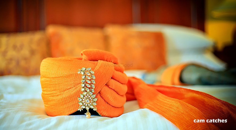 Photo of Embellished safa for groom in orange