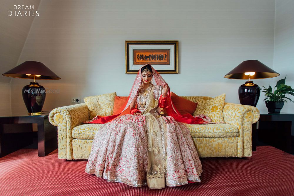 Photo of Red and pink Anamika Khanna lehenga