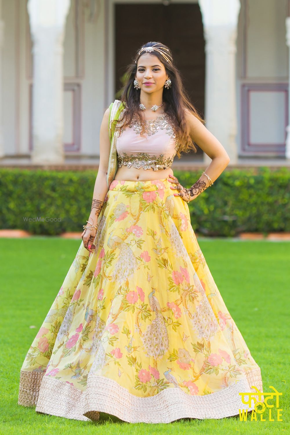 Photo of Yellow floral print lehenga with metallic blouse