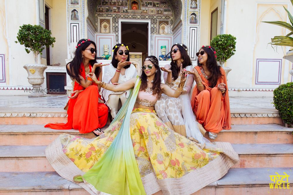 Photo of Fun bridesmaid photo with bride in yellow lehenga