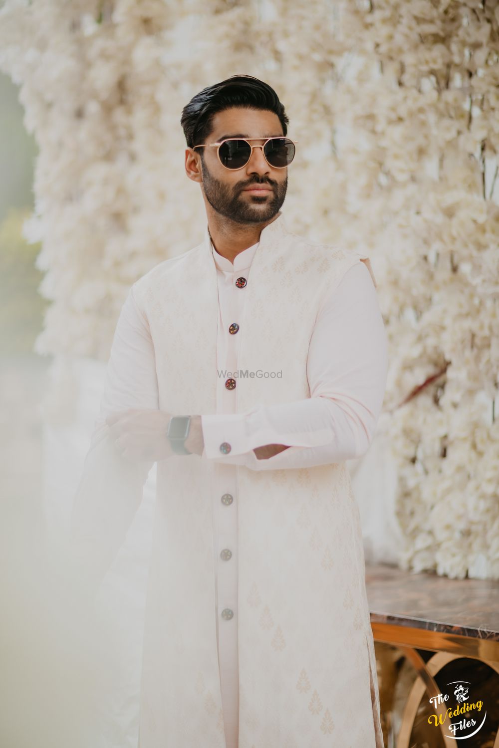 Photo of Groom dressed in all white.