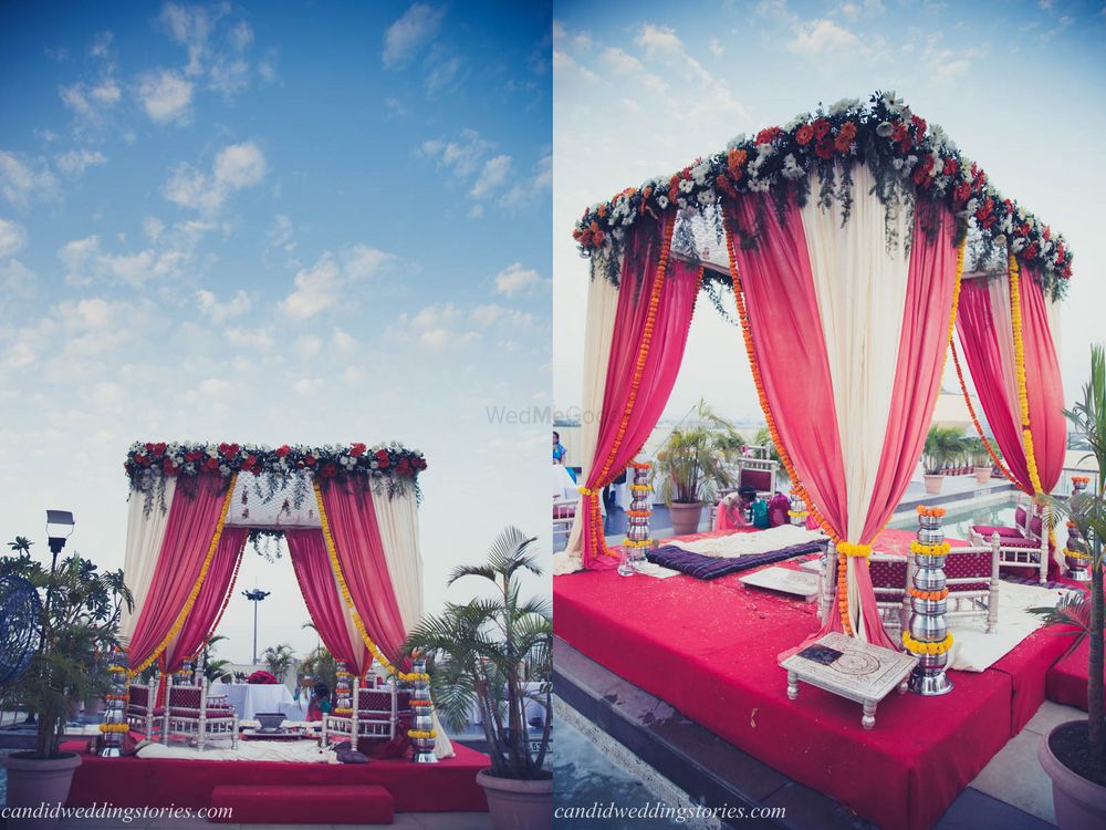 Photo of Light pink and red outdoor mandap