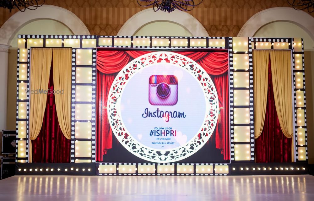 Photo of Theatre theme sangeet with instagram hashtag on stage