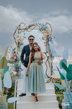 Photo of Lovely couple portrait with the bride in an aqua blue dress that  is matching with aqua blue decor elements