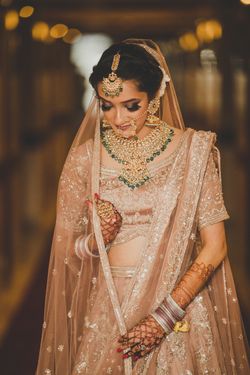 bride in golden lehenga
