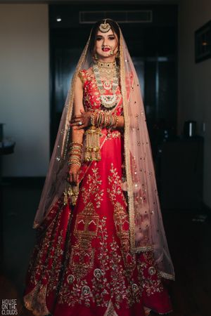 red and green bridal lehenga