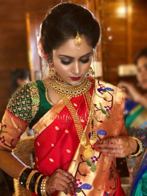 Beautiful maharashtrian bride in traditional green and red 