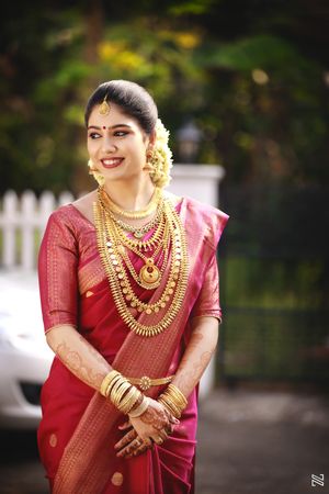 South Indian Bride Wearing Green and Pink Saree