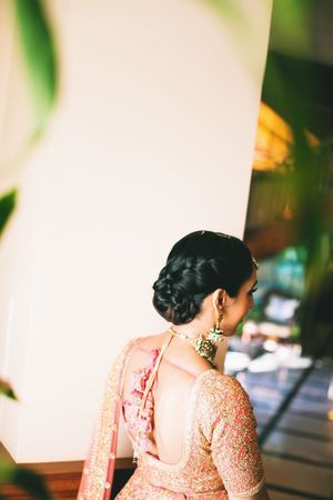 Poufed braided bun for sangeet or reception