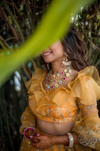 Photo of Funky mehendi jewellery with a yellow lehenga