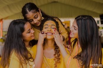 Cute haldi photo with bride and bridesmaids 