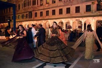 Photo of Bride dancing on the stage at her sangeet