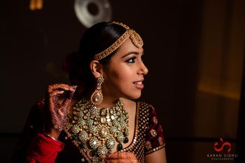 Photo of grand bridal necklace set with velvet lehenga
