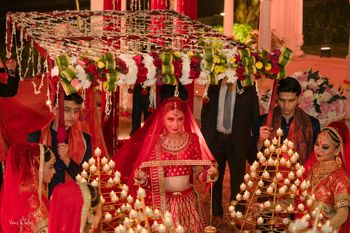 Bridal entry with tea lights & under a phoolon ki chaadar