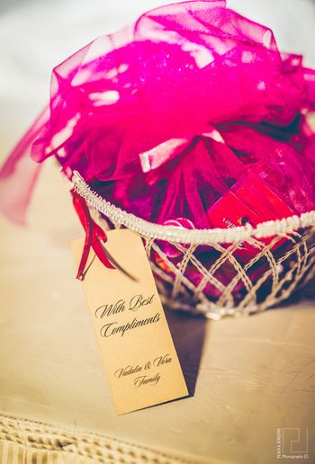 jewelled pink wedding favors with net covering.