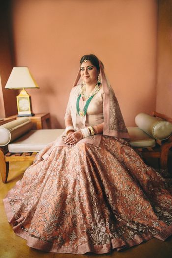 elegant pastel peach bridal lehenga with long top