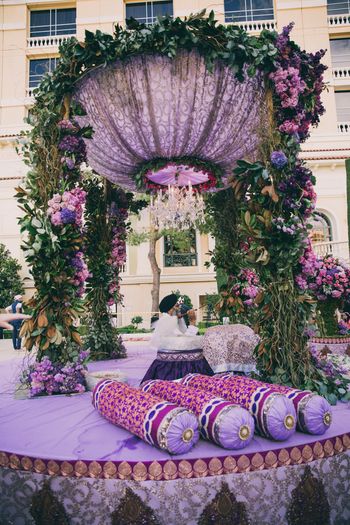 Photo of Purple and lavender mandap with chandelier