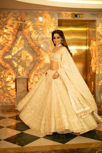 Engagement lehenga in ivory and gold 