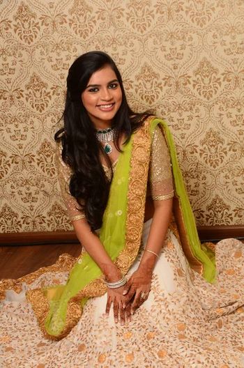 Photo of white and green with gold embroidery