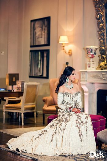 Offshoulder white gown by Manish Malhotra