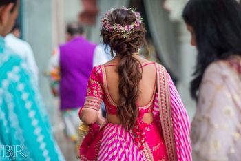 Photo of Mehendi hairdo with ponytail and floral wreath